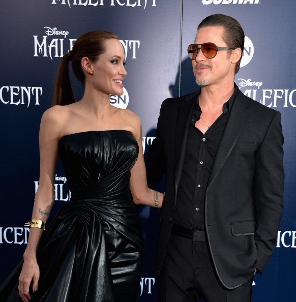 HOLLYWOOD, CA - MAY 28:  Actress Angelina Jolieand Brad Pitt arrive at the World Premiere Of Disney's "Maleficent" at the El Capitan Theatre on May 28, 2014 in Hollywood, California.  (Photo by Frazer Harrison/Getty Images)